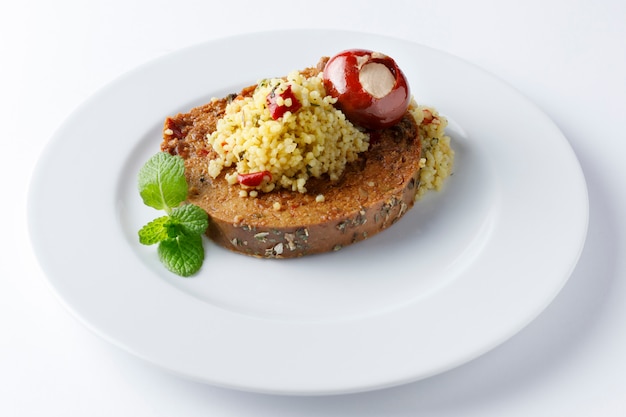 Vegan roast with quinoa salad and stuffed red pepper