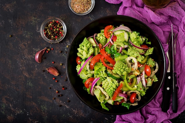 Vegan salad of fresh vegetables and cabbage romanesko