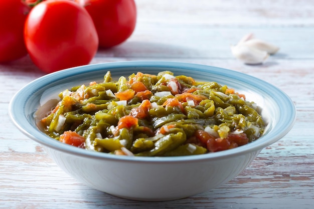 Vegan salad of roasted peppers and tomatoes with onion Healthy food