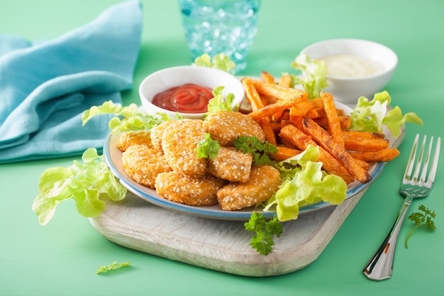 Vegan soy nuggets and sweet potato fries healthy meal