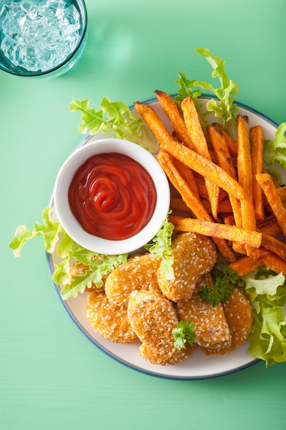 Photo vegan soy nuggets and sweet potato fries