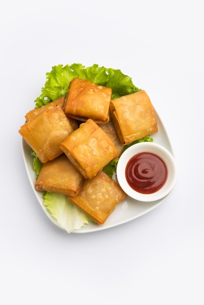 Vegetable Chinese samosa is a square shape a deep-fried snack prepared with homemade pastry sheets and tasty noodles stuffing