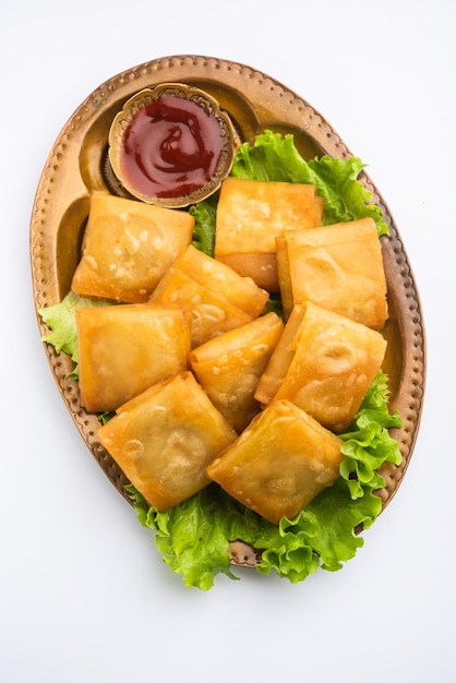 Vegetable Chinese samosa is a square shape a deep-fried snack prepared with homemade pastry sheets and tasty noodles stuffing