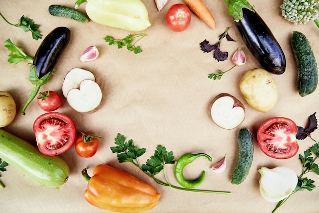 Vegetable frame beet basil eggplant parsley bell pepper hot pepper potatoes cucumber carrots Italian vegetable recipe Veganism concept foodTop view copy space High quality photo