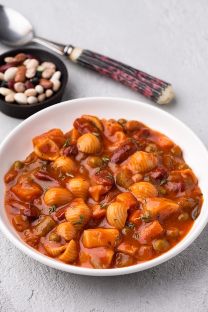 vegetable grains peas soup in tomato sauce