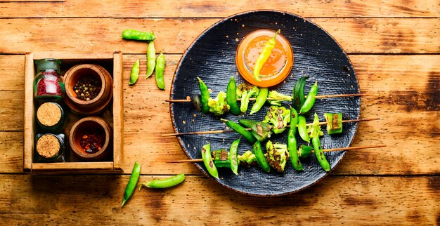 Vegetable kebab with broccoli, green peas and okra.Roasted vegetables on stick.Diet kebab