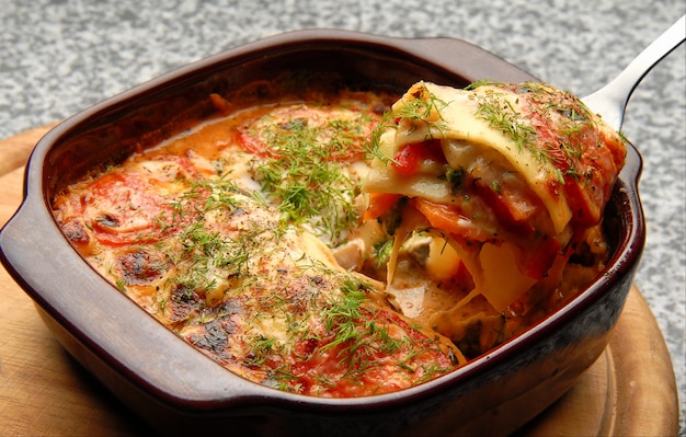 Vegetable lasagna with sauce and dill