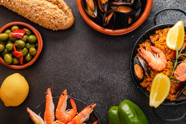 Vegetable paella with seafood, top view and copy space