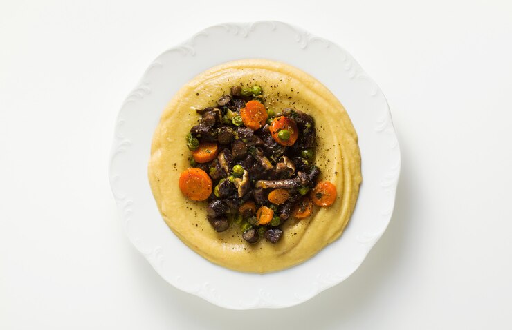 Vegetable puree with mushrooms in a plate on the table. healthy cuisine for children or family