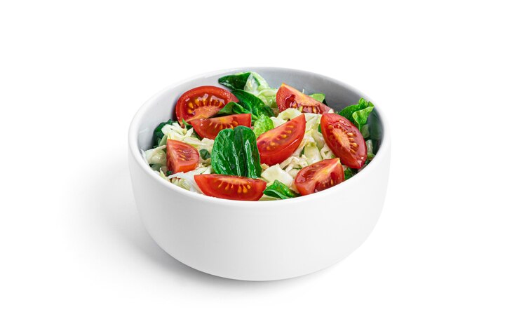 Photo vegetable salad isolated on white.