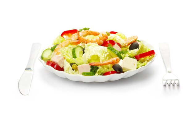 Vegetable salad in plate on white