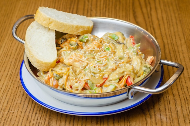 Vegetable salad in sauce with bread