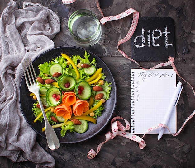 Vegetable salad, water and  tape measure