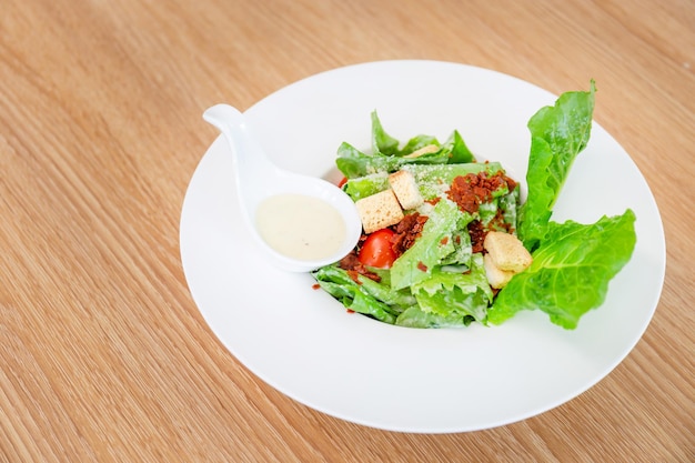 Vegetable salad on a white plate on the table