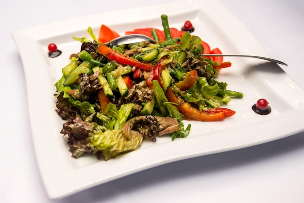 Vegetable salad with asparagus and sweet and sour sauce
