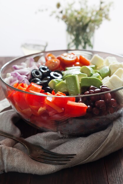 Vegetable salad with avocado, olives and pepper