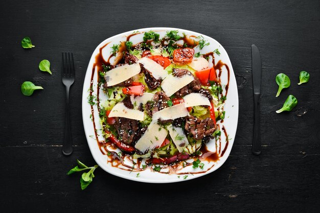 Vegetable salad with beef and parmesan cheese Top view free copying space