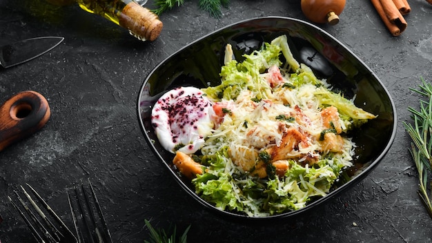 Vegetable salad with chicken fillet and poached egg Caesar salad Top view Free copy space