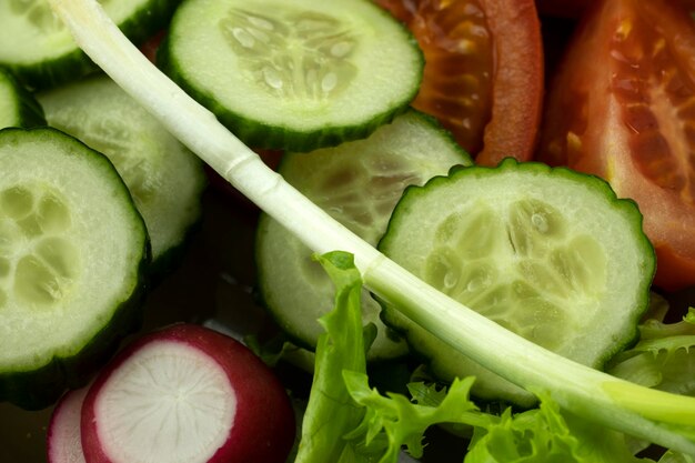 Vegetable salad with fresh vegetables and lettuce closeup