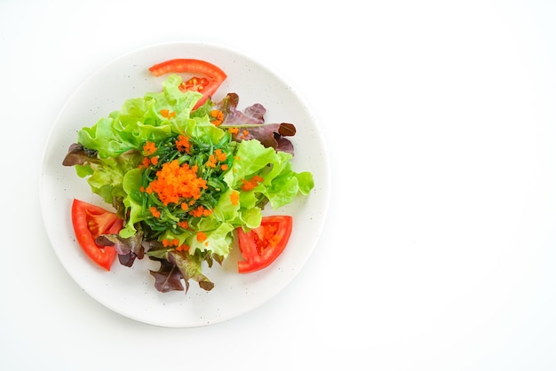 vegetable salad with Japanese seaweed and shrimp eggs on white