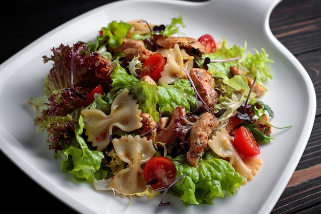 Vegetable salad with meat on a plate