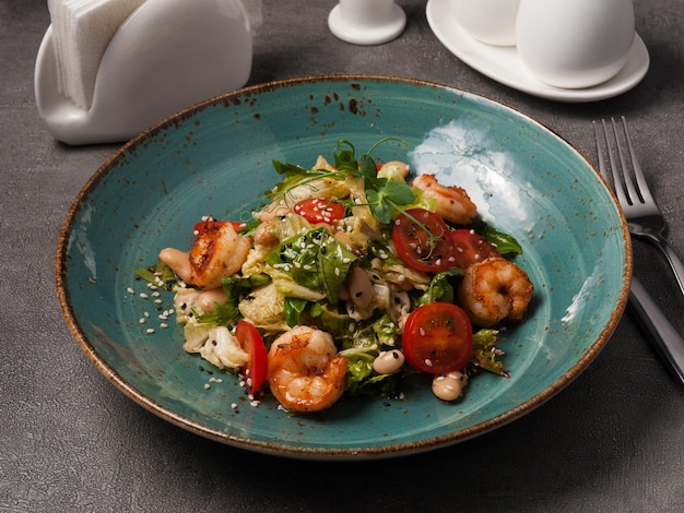 Vegetable salad with white beans grilled shrimp and cherry tomatoes