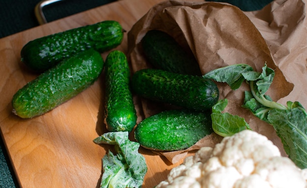 Vegetable set of cucumbers and cauliflower lies on the table