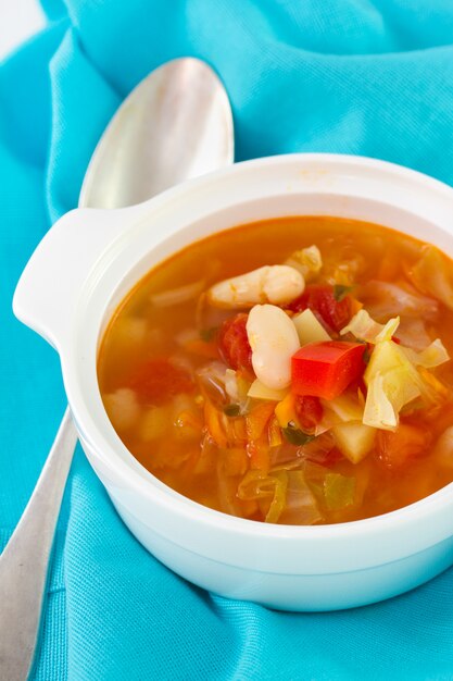 Photo vegetable soup in bowl and spoon