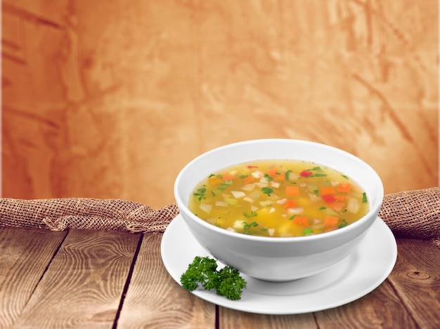 Photo vegetable soup isolated on background