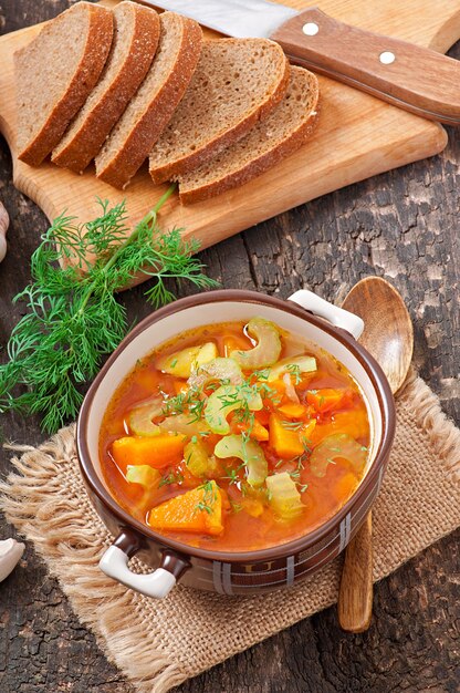 Vegetable soup on the old wooden surface