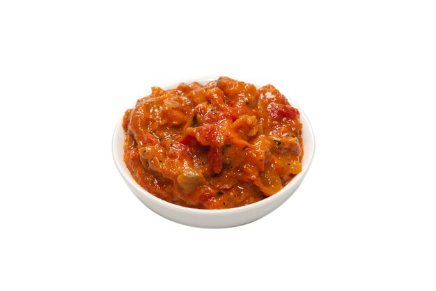 Vegetable stew in a bowl isolated on white surface.