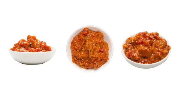 Vegetable stew in a bowl isolated on white surface.