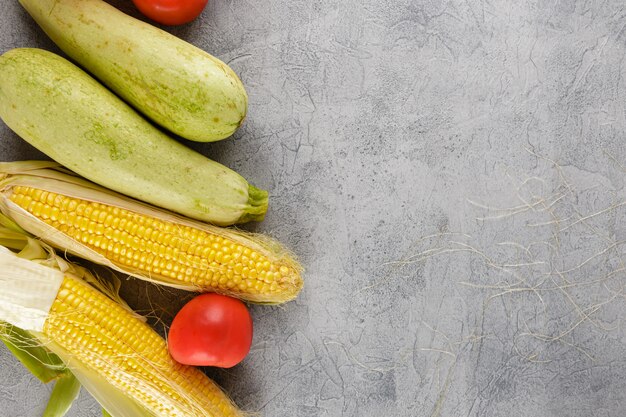 Vegetables background corn, tomatoes, zucchini