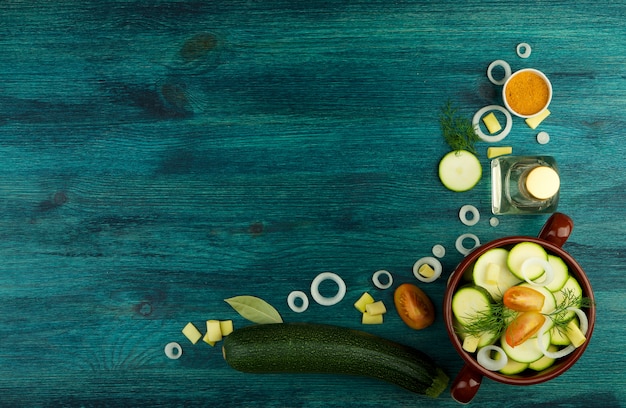 VEGETABLES ON BACKGROUND. FRESH VEGETABLES AND SPICES ON A WOODEN SURFACE. COPY SPACE