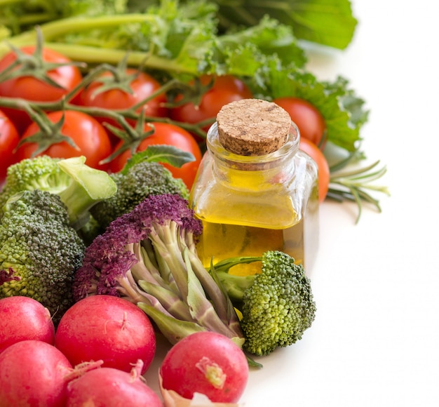 Vegetables and bottle of olive oil