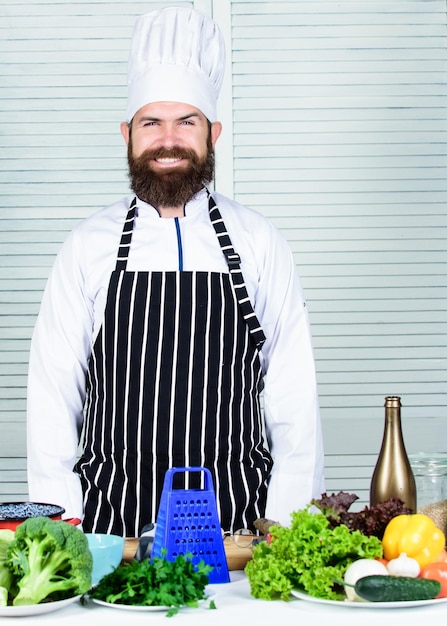 Vegetables easy meal Chef near greenery lettuce cabbage broccoli fresh vegetables and cooking utensils All we need cook healthy Chef going use grater for cooking dish Vegetables main ingredient