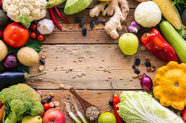 Vegetables frame on wooden background flat lay composition