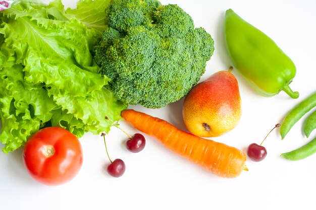 Vegetables and fruits on a white background, flat lay