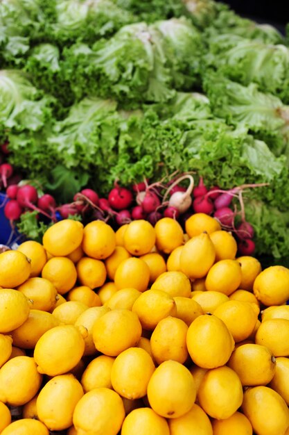 Vegetables, lemons and lettuces on market