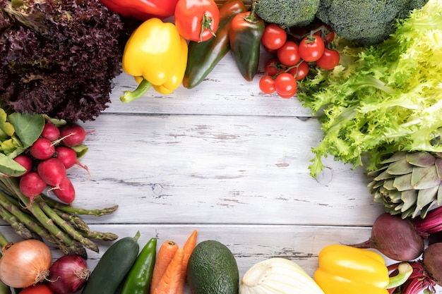 Vegetables on old light wooden table