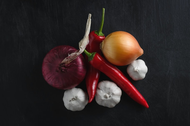 Vegetables red and yellow onions with red pepper and garlic.