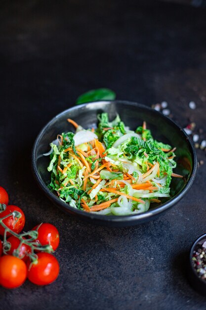 Vegetables salad snack Peking cabbage savoy, onion, carrot, pepper and other