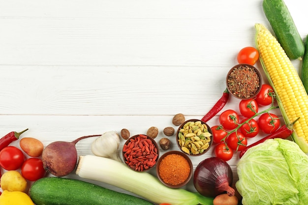 Vegetables and spices on wooden table