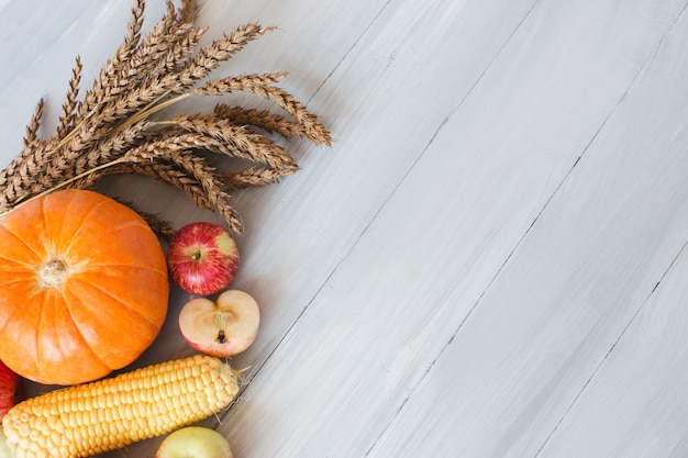 Photo vegetables on a wooden background, top view