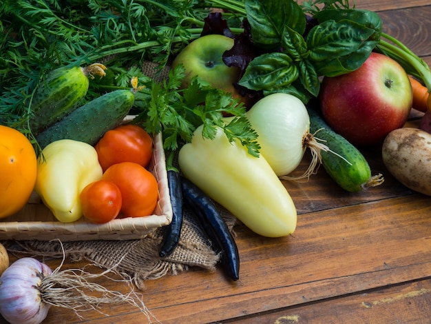 Vegetables on a wooden table. Bio Healthy food, herbs and vegetables from farm plantations.