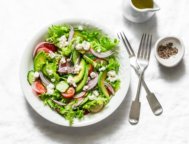 Vegetarian avocado vegetables feta cheese salad and grilled bread delicious healthy lunch snack