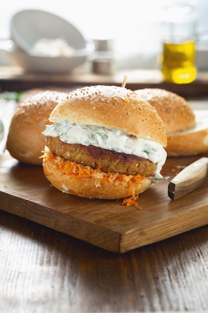 Vegetarian burger on a wooden cutting board