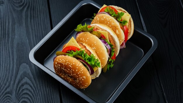Vegetarian burgers on black background