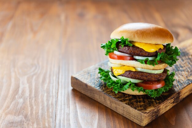 Vegetarian cheeseburger on a wooden table