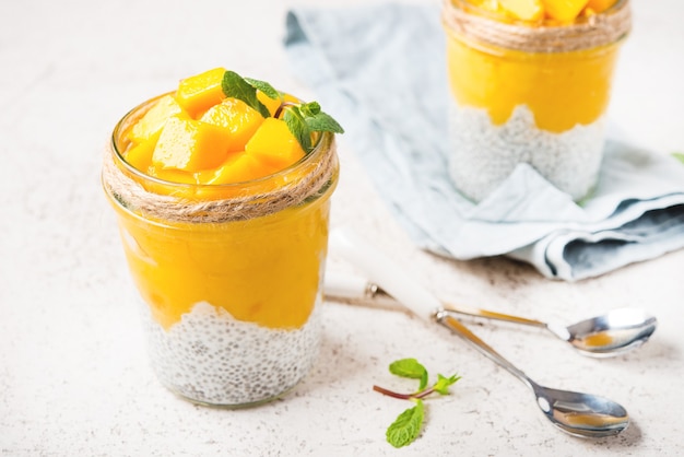 Vegetarian chia pudding with mango in a jar, selective focus
